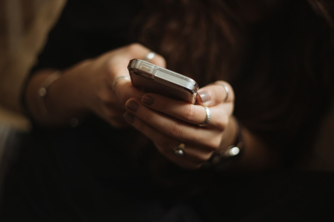 person reading news on phone